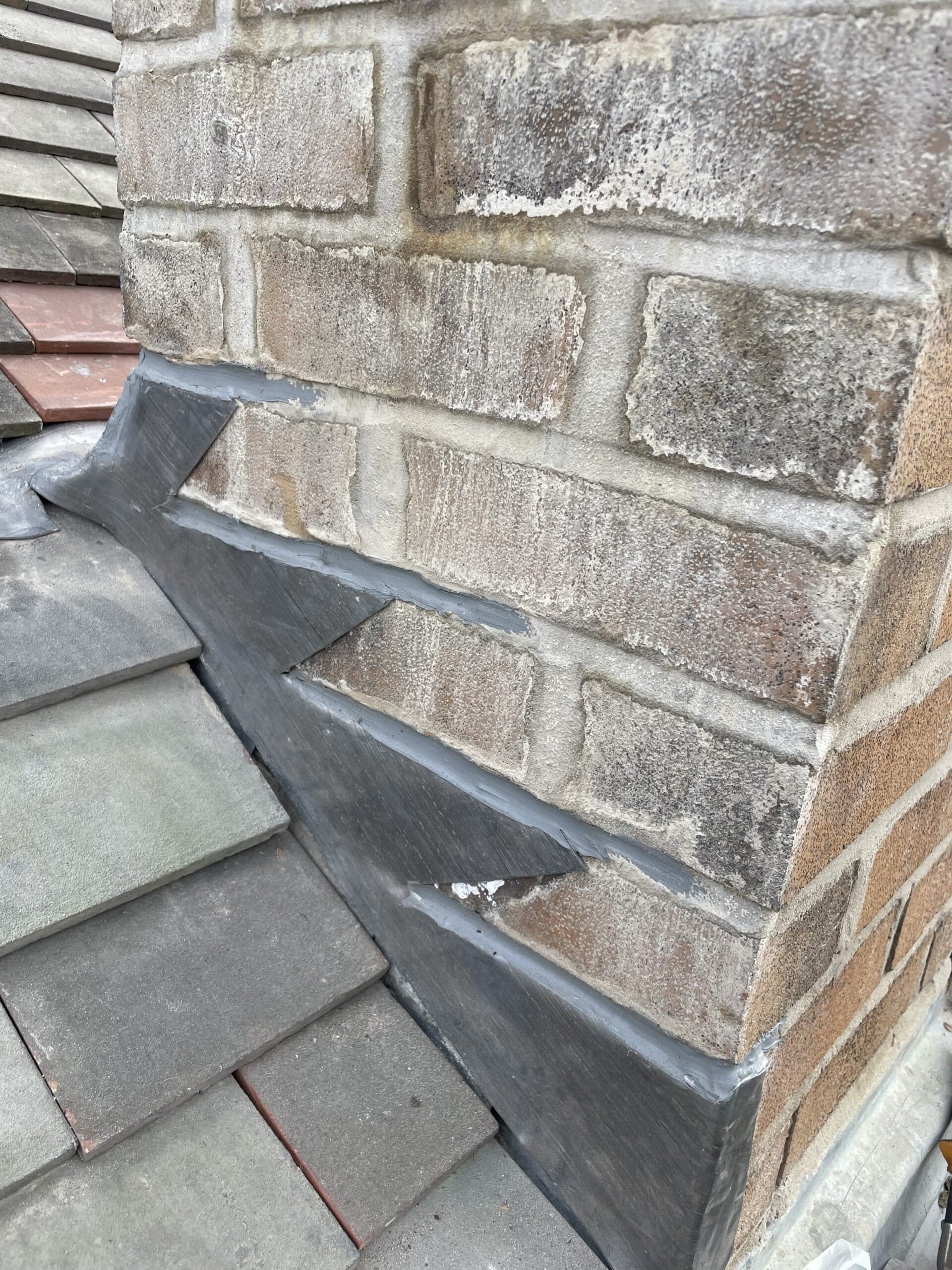 New lead flashing where a slate roof meets brickwork
