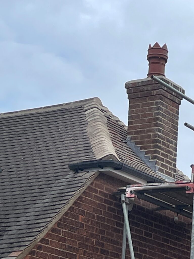Tiled roof and chimney after a roof upgrade